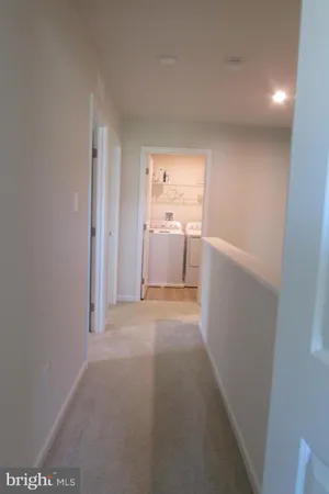 a view of a room with furniture and windows