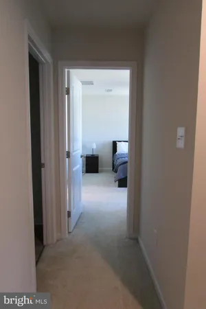 a view of living room with furniture and a gate