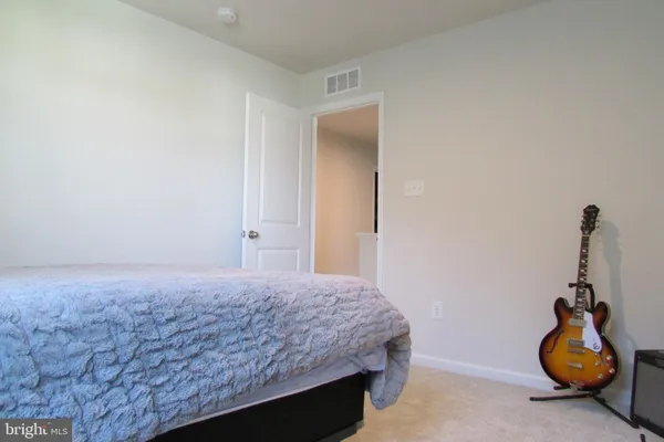 a bedroom with a bed and cabinets