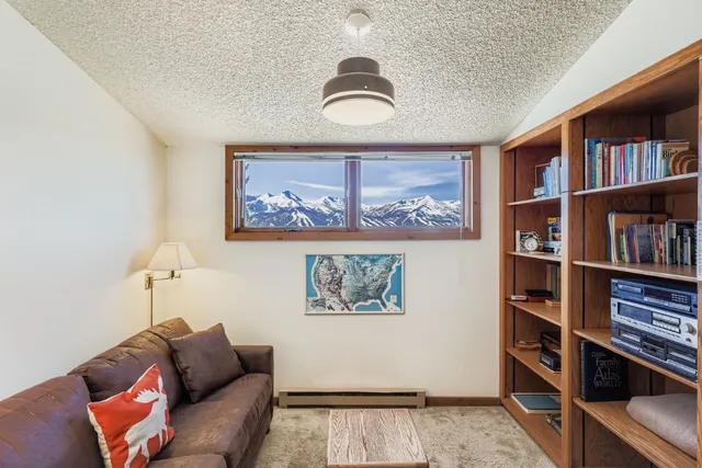 a view of room with a bed and a window