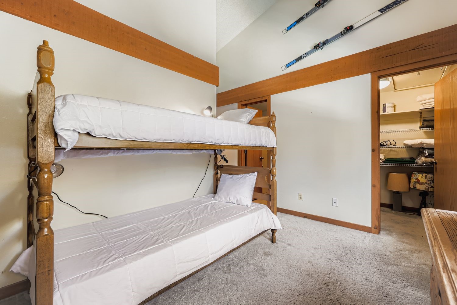 93 Fuller Placer Road, Unit F Breckenridge, CO 80424 - Photo 14 of 26 a bedroom with a bed and a large window