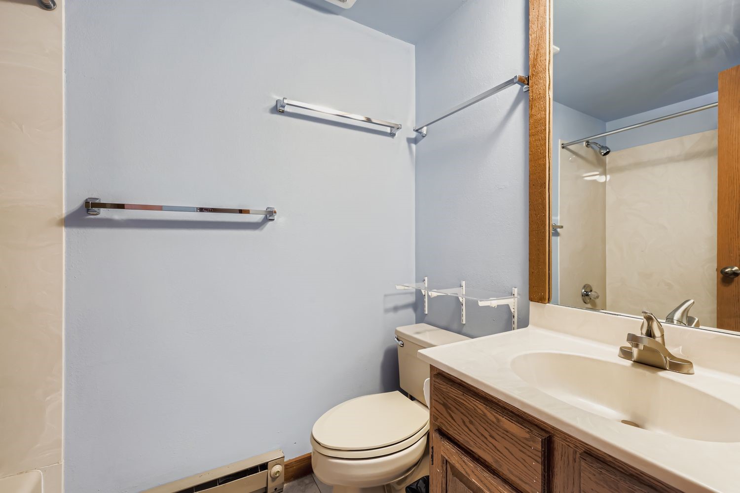 93 Fuller Placer Road, Unit F Breckenridge, CO 80424 - Photo 15 of 26 a bathroom with a sink a toilet a mirror and shower