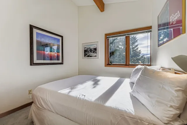 a view of a storage and utility room with washer and dryer