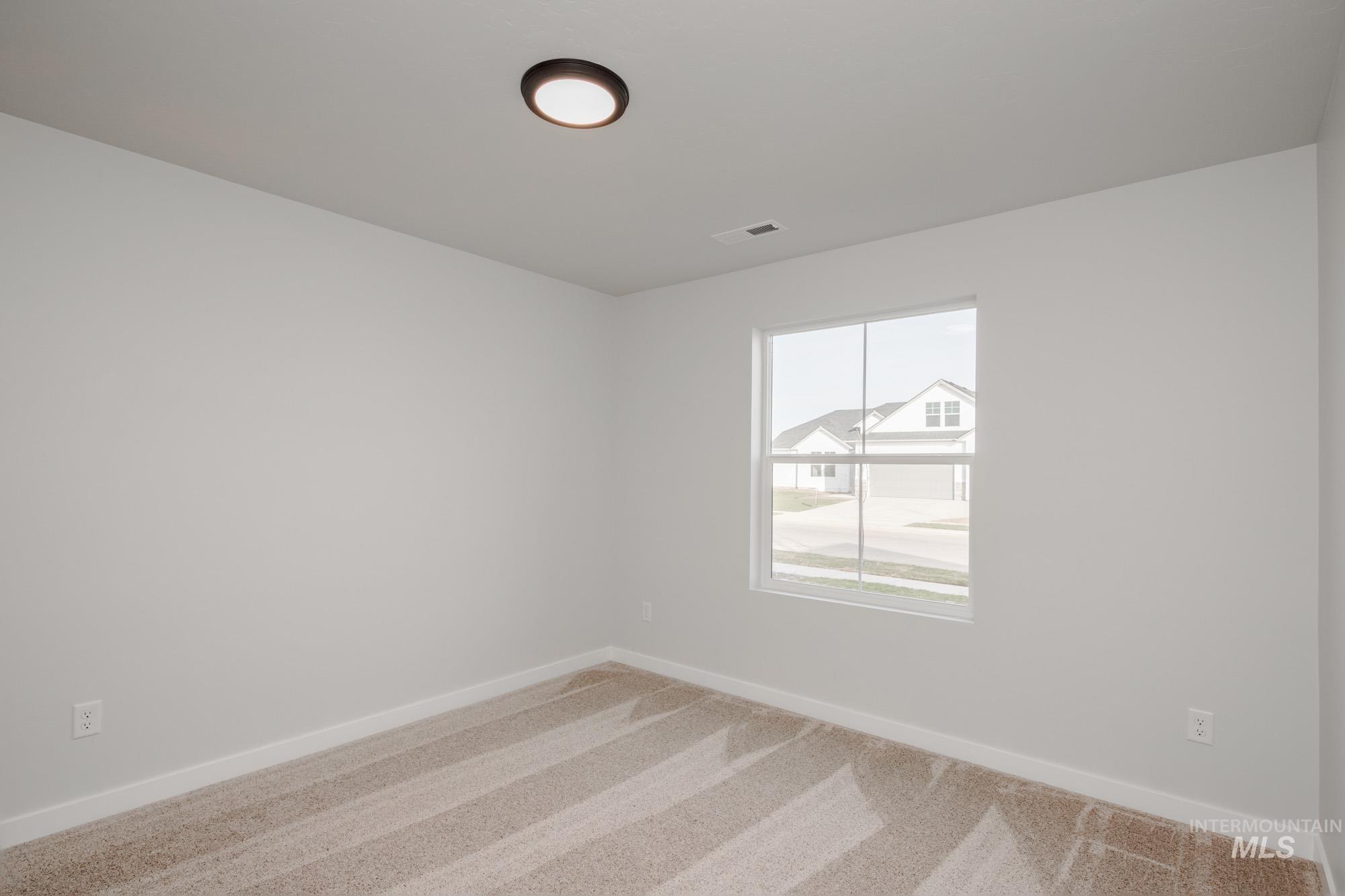 1613 Covington Street Middleton, ID 83644 - Photo 16 of 25 Empty room with baseboards and carpet flooring