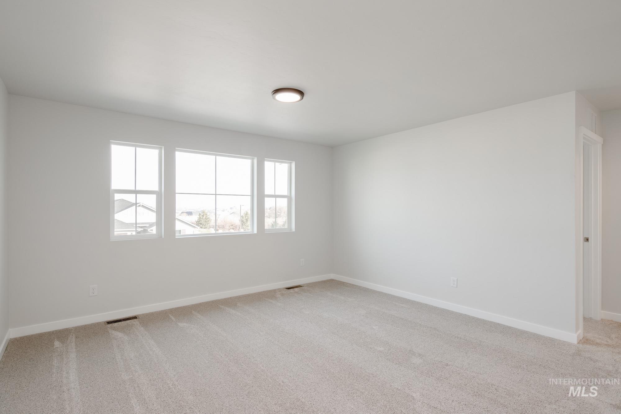 1613 Covington Street Middleton, ID 83644 - Photo 19 of 25 Empty room featuring light carpet