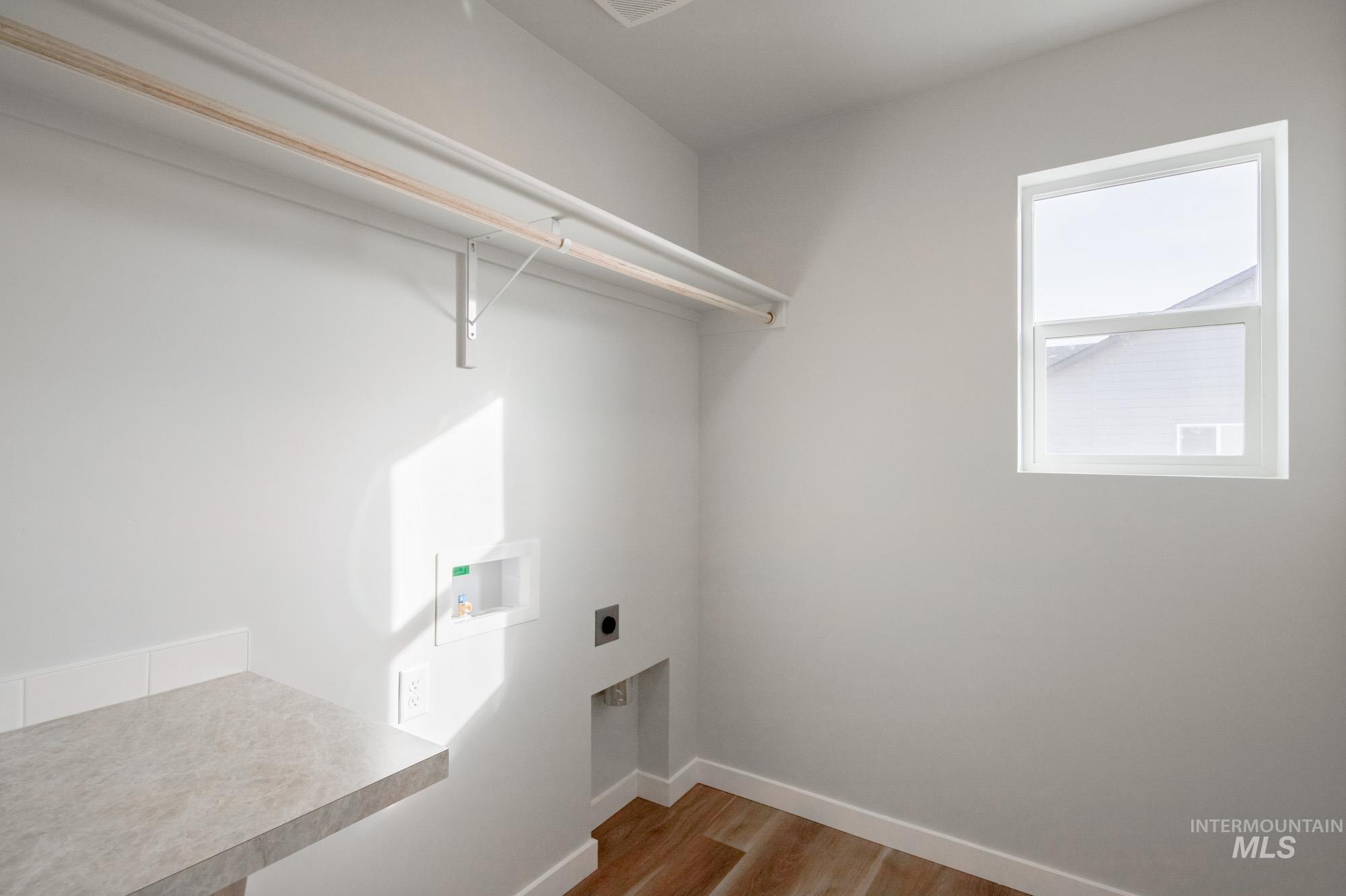 1613 Covington Street Middleton, ID 83644 - Photo 21 of 25 Laundry room with wood finished floors, hookup for a washing machine, and hookup for an electric dryer