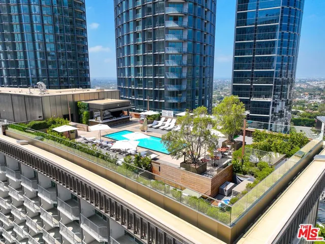 a view of a garden with an outdoor seating