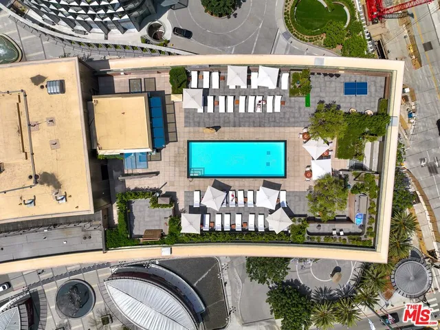 swimming pool view with a outdoor seating space