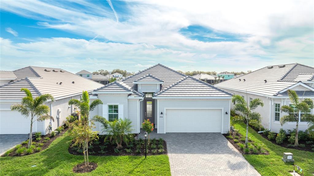 19156 Cherrystone Way Lakewood Ranch, FL 34211 - Photo 2 of 49 front view of a house with a garden