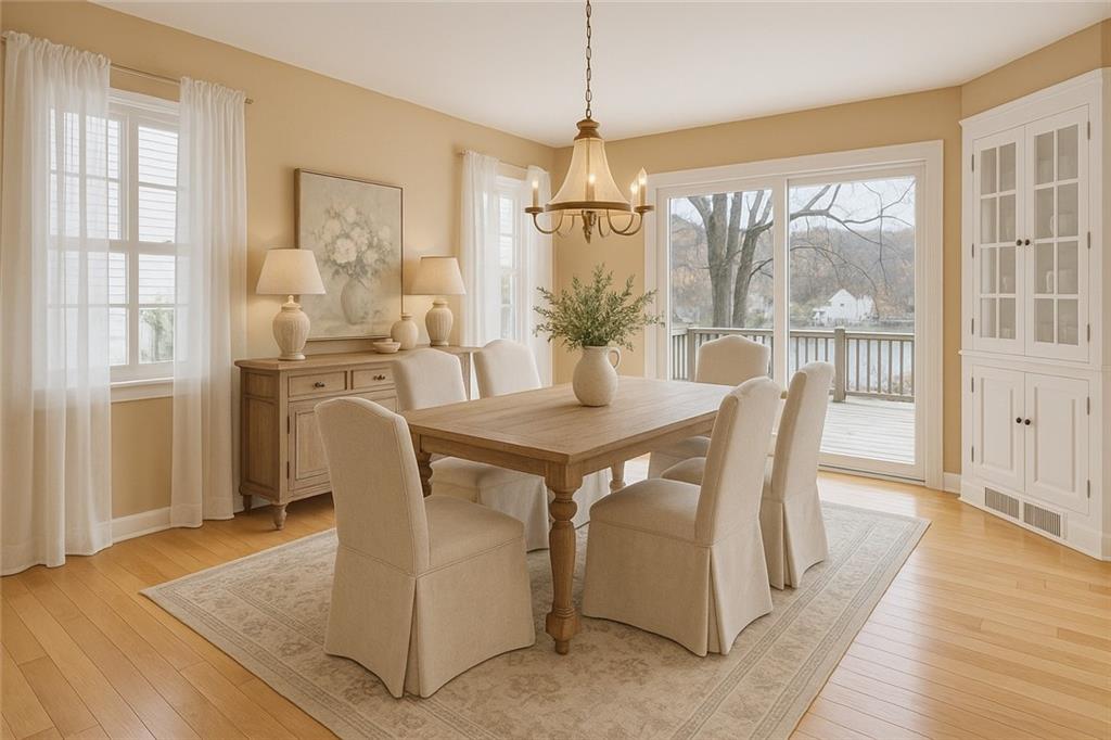 198 Oak Street Beaver, PA 15009 - Photo 13 of 39 a dining room with furniture a chandelier and wooden floor