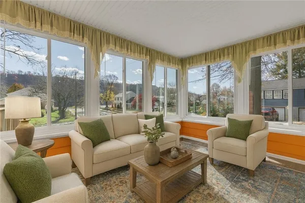 a living room with furniture and a large window