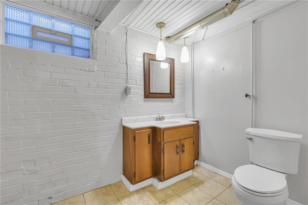 198 Oak Street Beaver, PA 15009 - Photo 32 of 39 a bathroom with a toilet a sink and mirror