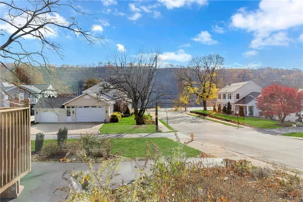 a view of a street with a building in the background