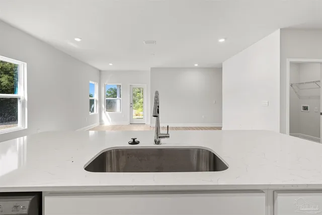 a kitchen with a sink and a window