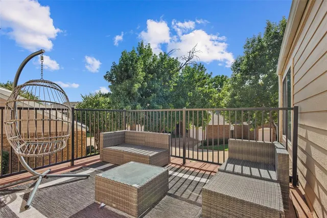 a view of a balcony with wooden floor