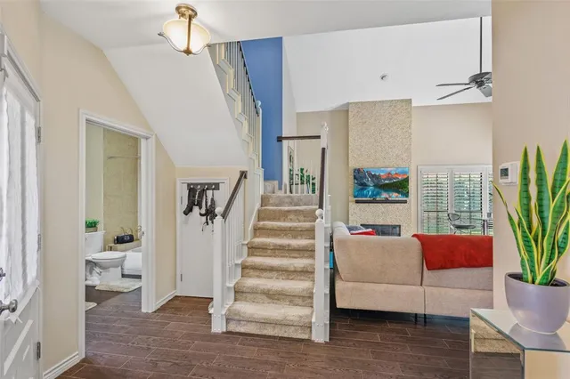 a view of entryway and hall with wooden floor