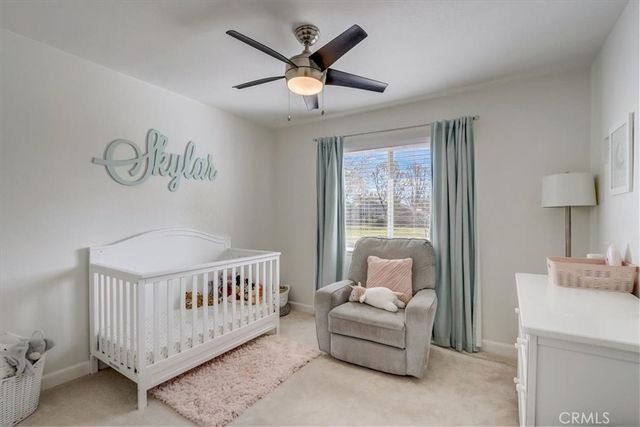 a bedroom with furniture and a window