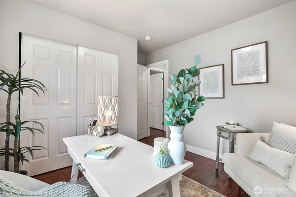 a bedroom with a bed and a table