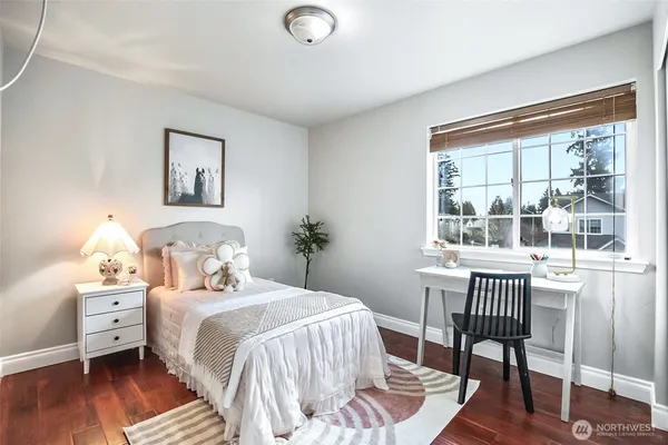 a bedroom with a bed and a table