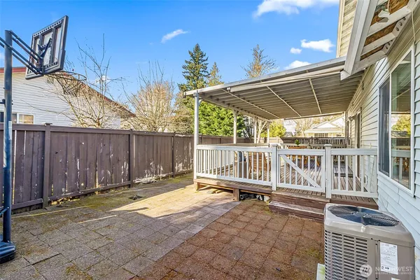 a view of a house with a wooden deck