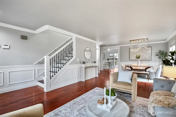 a kitchen with stainless steel appliances granite countertop wooden cabinets a sink dishwasher a stove and a refrigerator