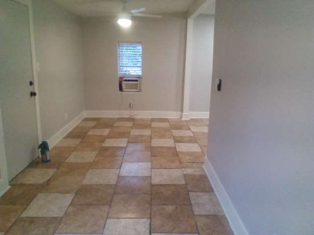 2113 River Road, Unit C San Marcos, TX 78666 - Photo 3 of 9 Empty room featuring baseboards and ceiling fan