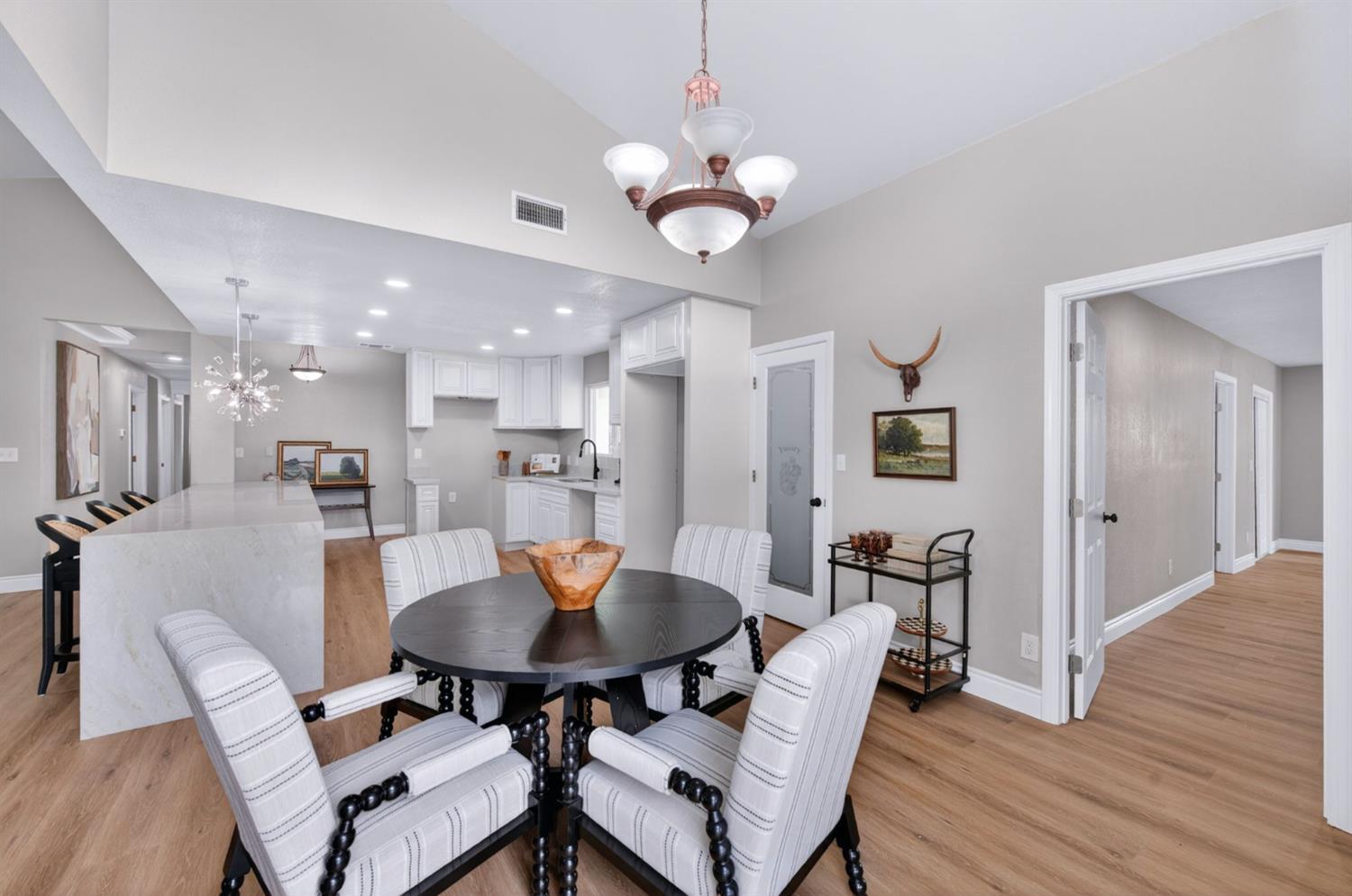 16564 Monreal Road Madera, CA 93636 - Photo 15 of 59 a view of a dining room with furniture and wooden floor