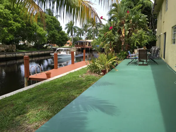 a view of yard with swimming pool and sitting area