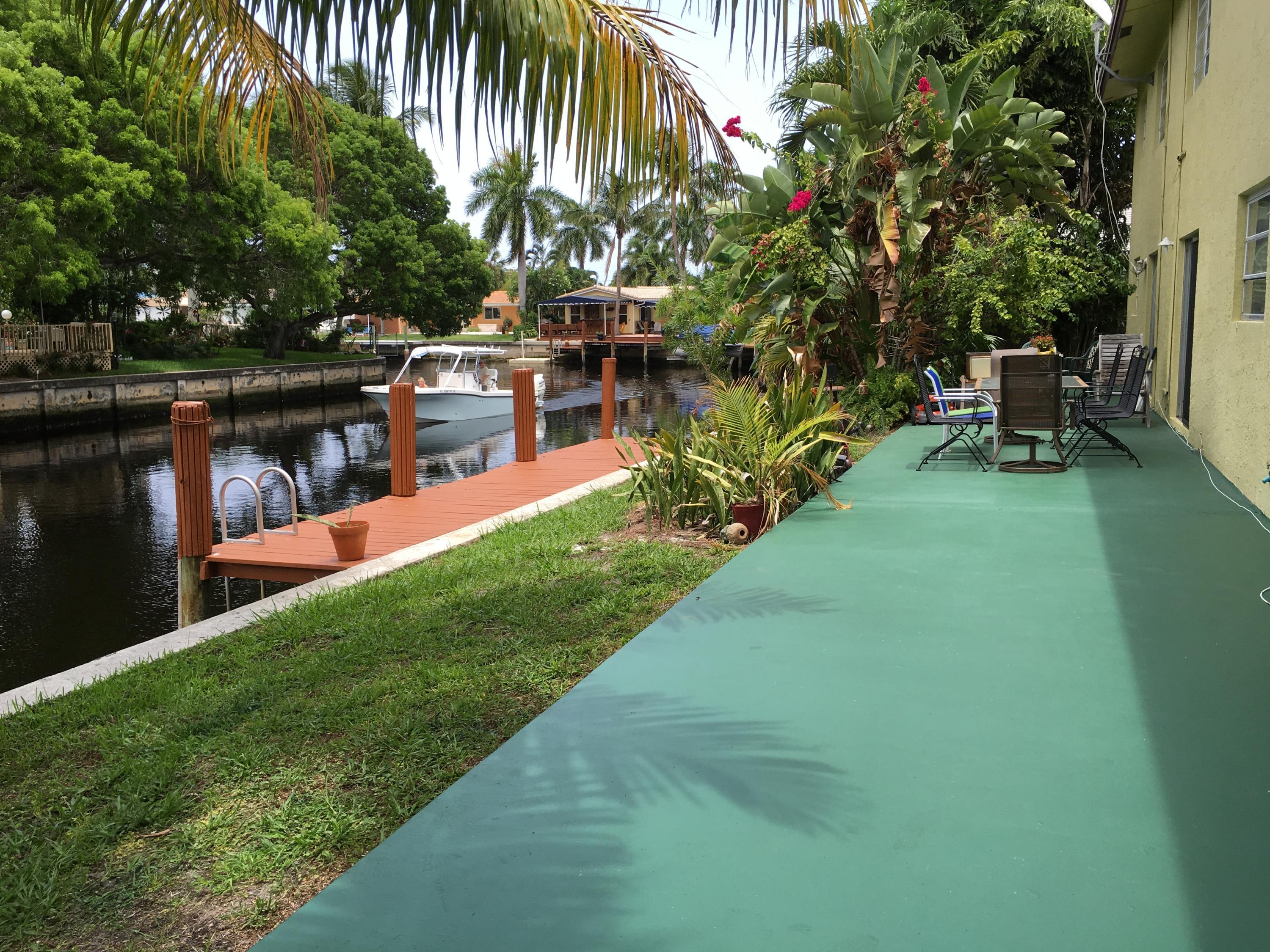 5811 Northeast 14th Road, Unit 1 Fort Lauderdale, FL 33334 - Photo 1 of 16 a view of yard with swimming pool and sitting area