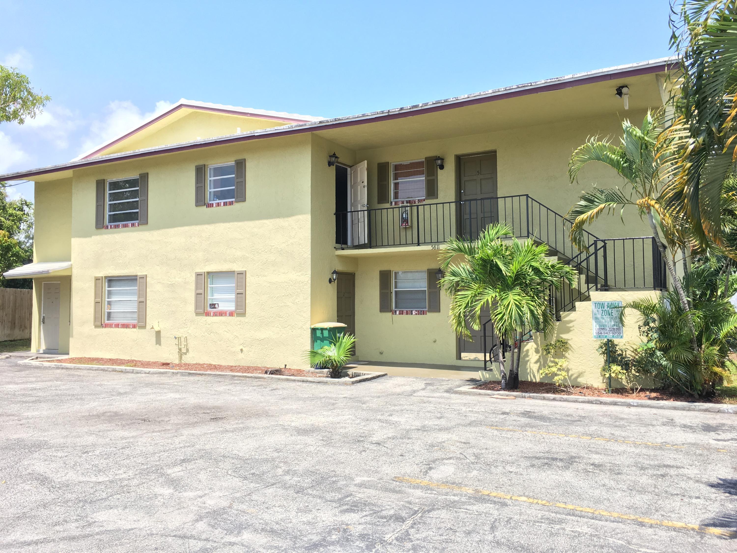 5811 Northeast 14th Road, Unit 1 Fort Lauderdale, FL 33334 - Photo 11 of 16 a front view of a house with a yard