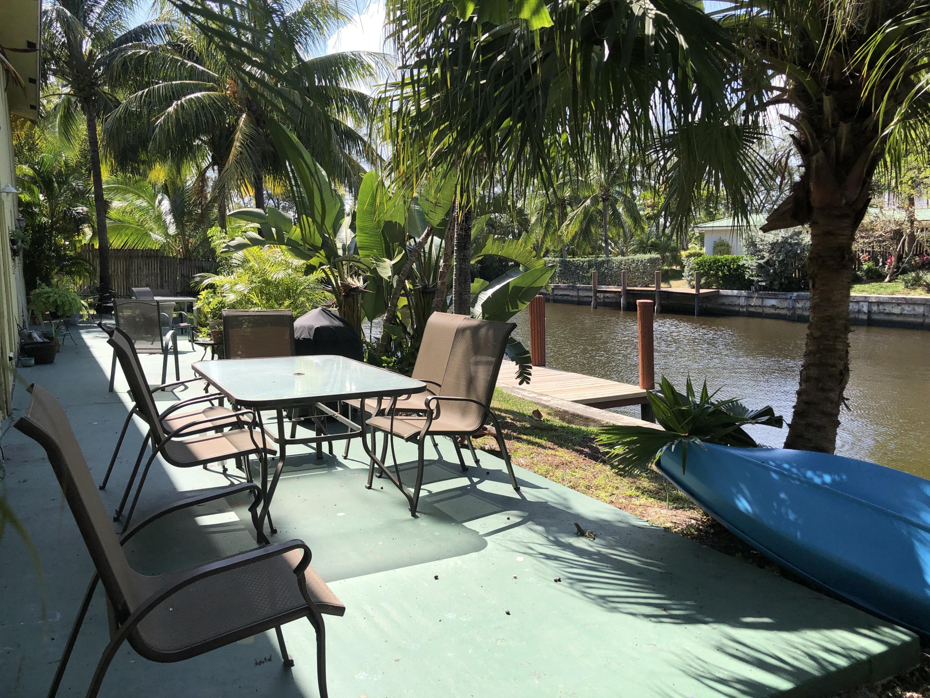 5811 Northeast 14th Road, Unit 1 Fort Lauderdale, FL 33334 - Photo 13 of 16 a view of a chairs and table in patio