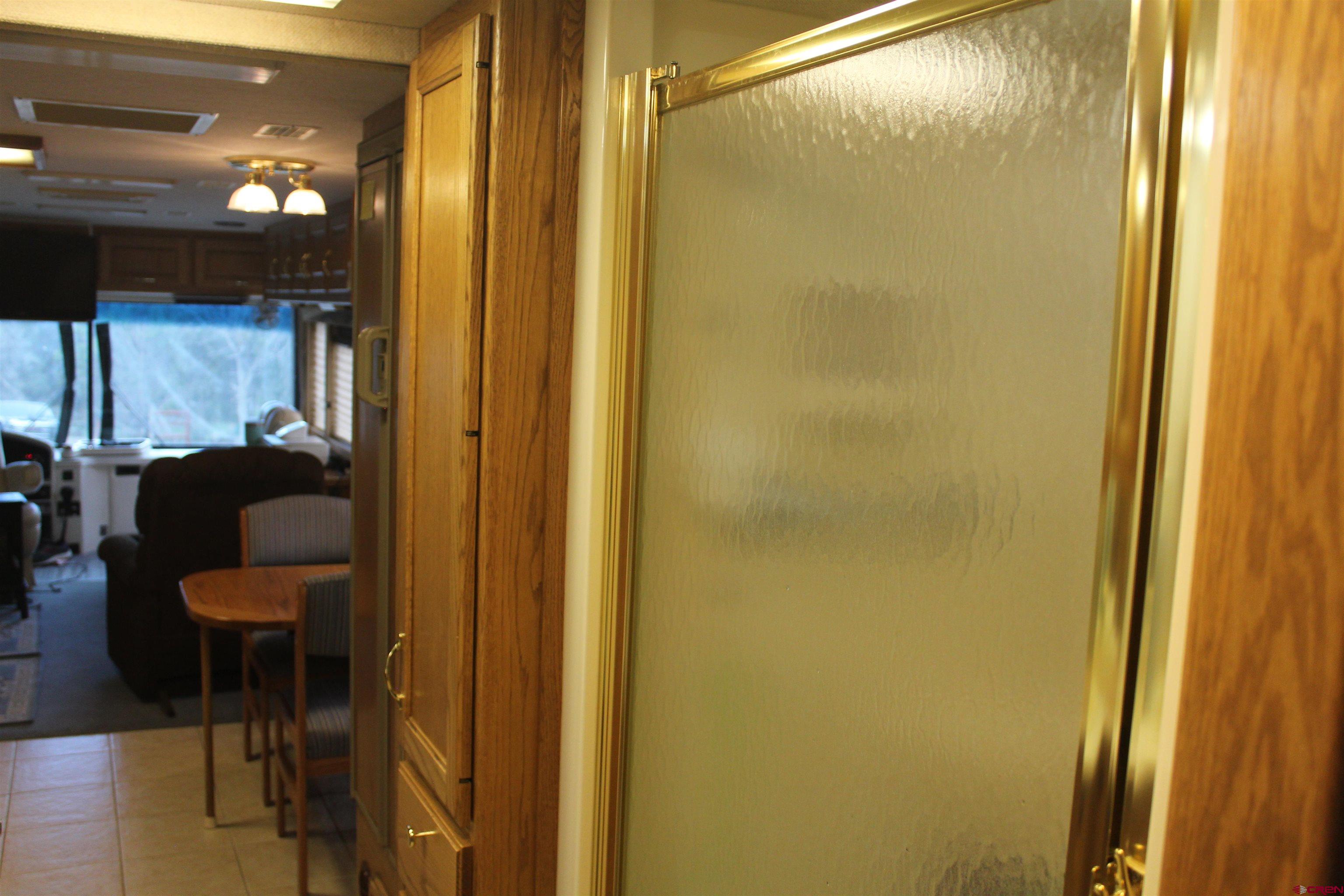 21051 Brimstone Road Cedaredge, CO 81413 - Photo 14 of 25 a bathroom with a glass door