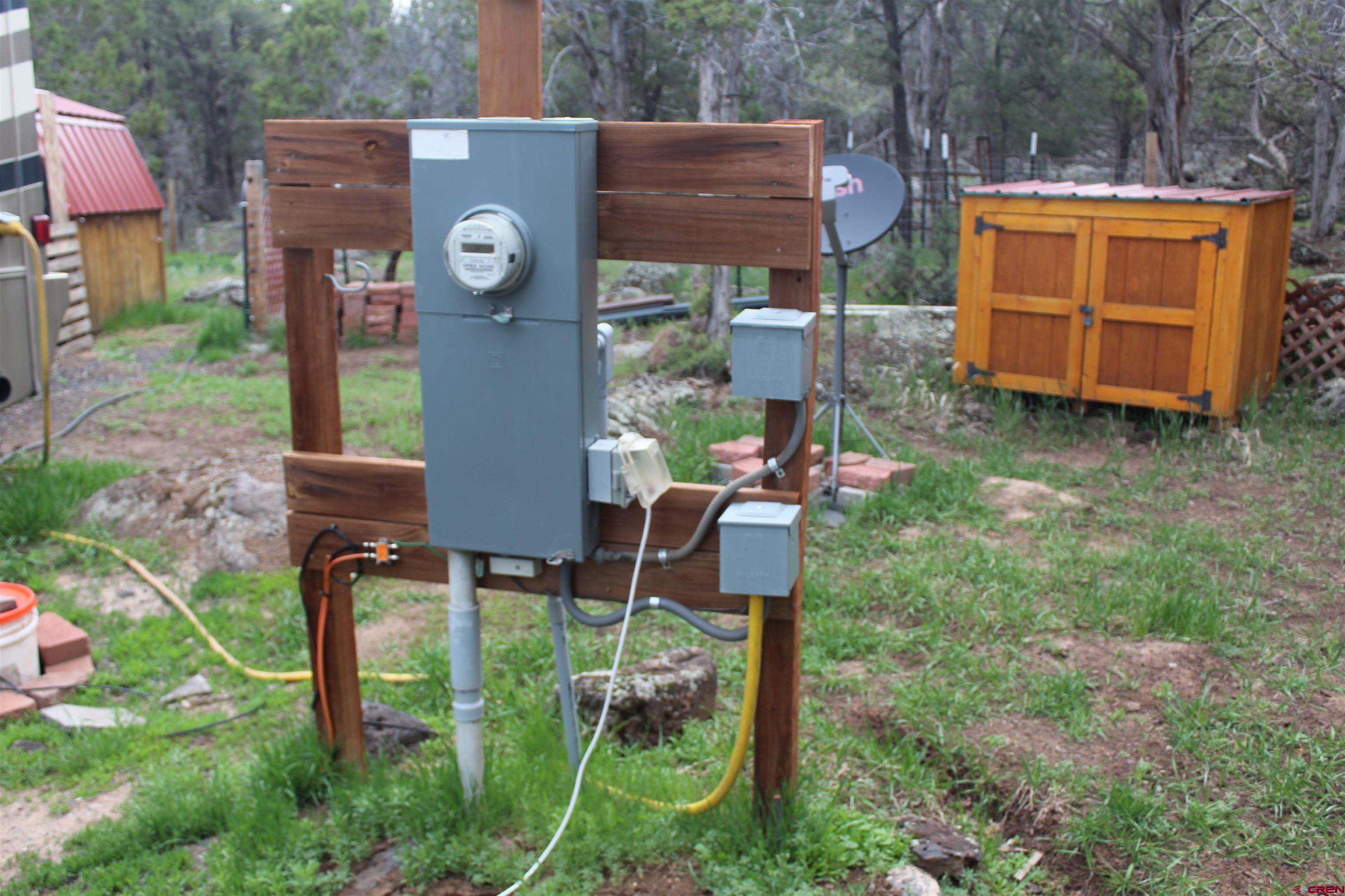 21051 Brimstone Road Cedaredge, CO 81413 - Photo 19 of 25 a backyard of a house with table and chairs