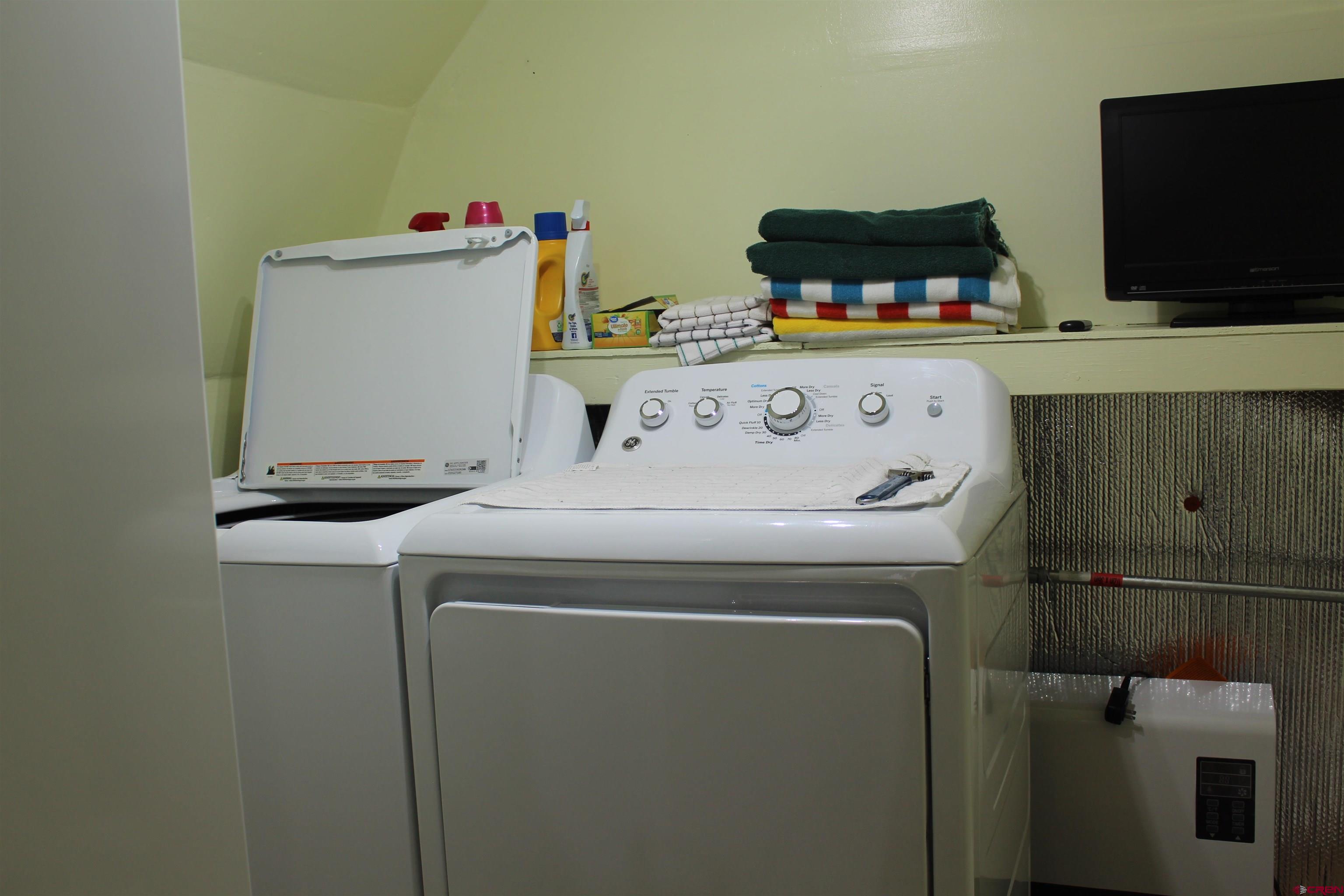 21051 Brimstone Road Cedaredge, CO 81413 - Photo 22 of 25 a utility room with dryer and washer