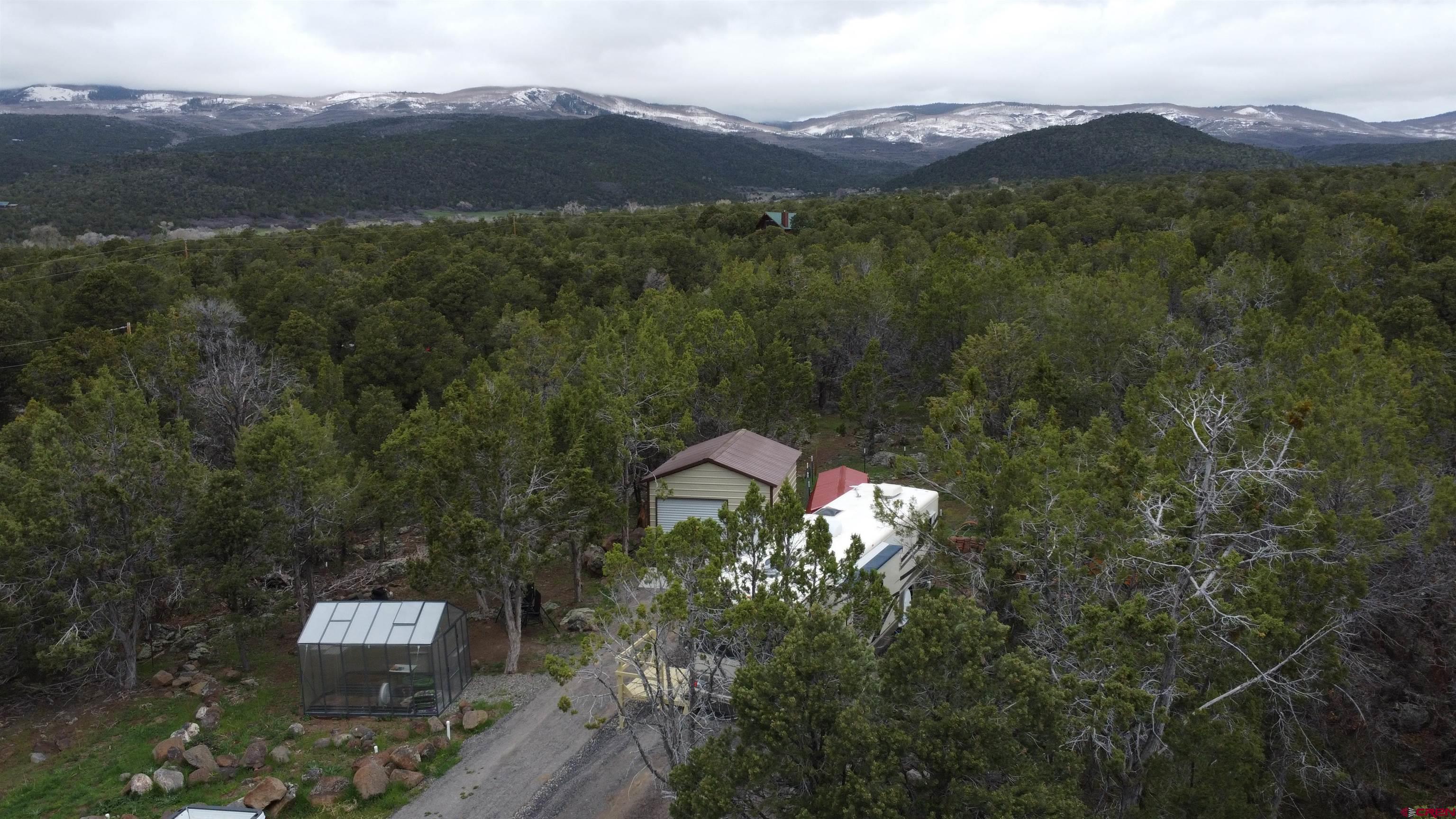 21051 Brimstone Road Cedaredge, CO 81413 - Photo 3 of 25 a view of a city with a mountain