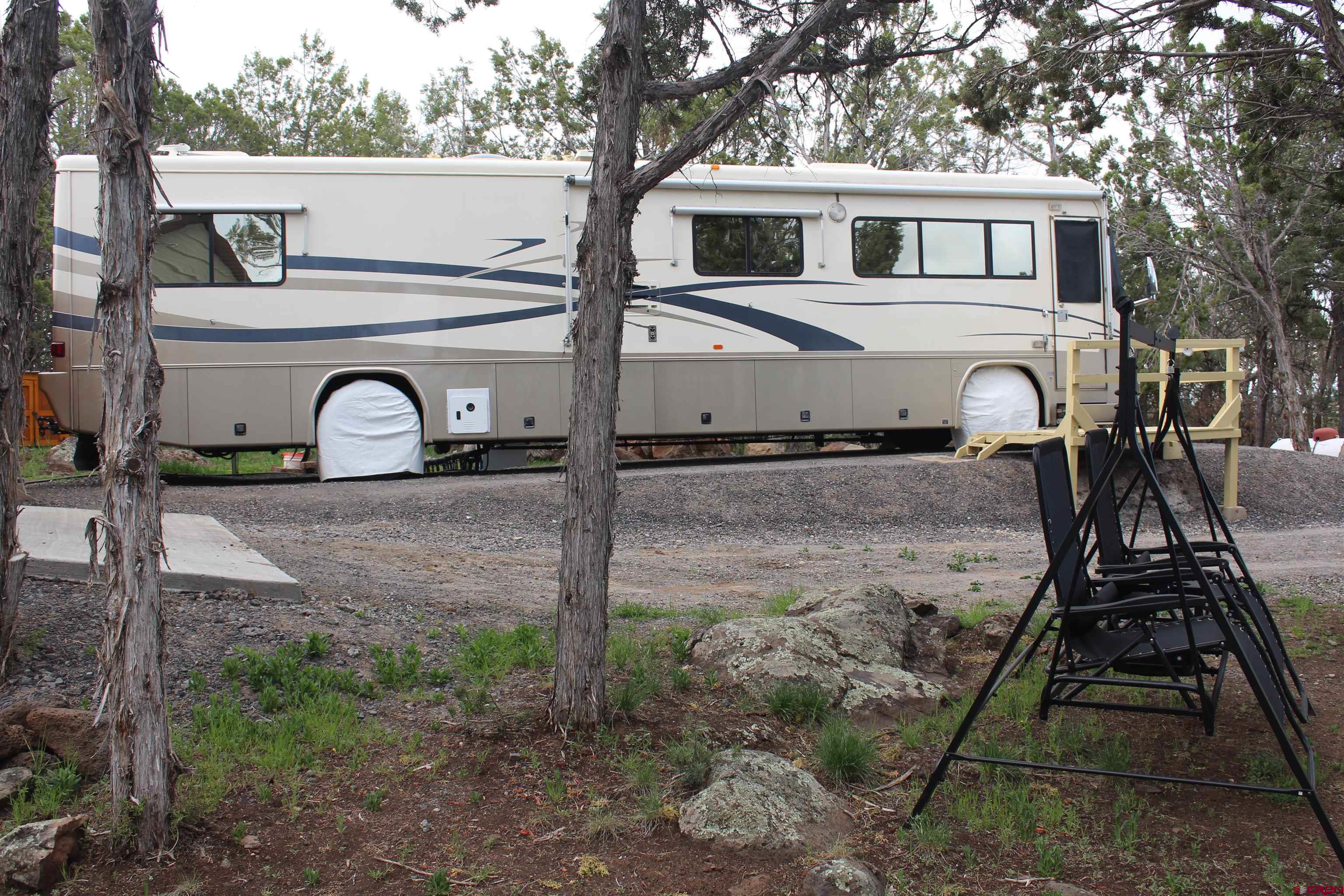 21051 Brimstone Road Cedaredge, CO 81413 - Photo 8 of 25 a front view of a house with garden