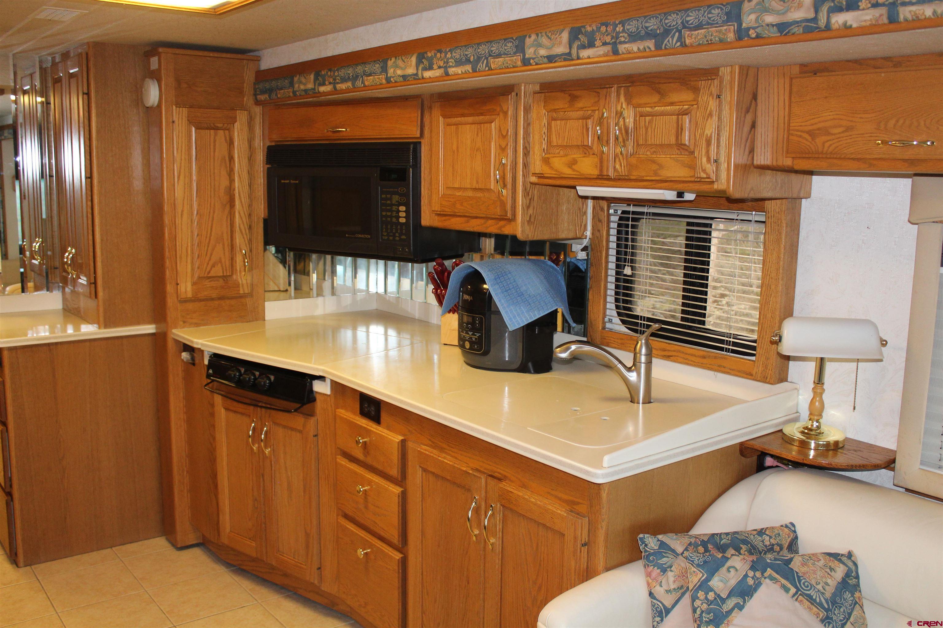 21051 Brimstone Road Cedaredge, CO 81413 - Photo 10 of 25 a spacious bathroom with a double vanity sink and a mirror