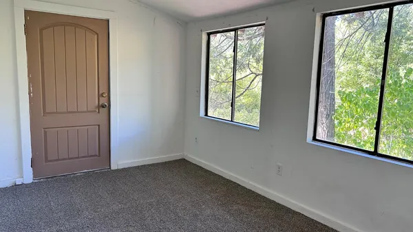 an empty room with windows