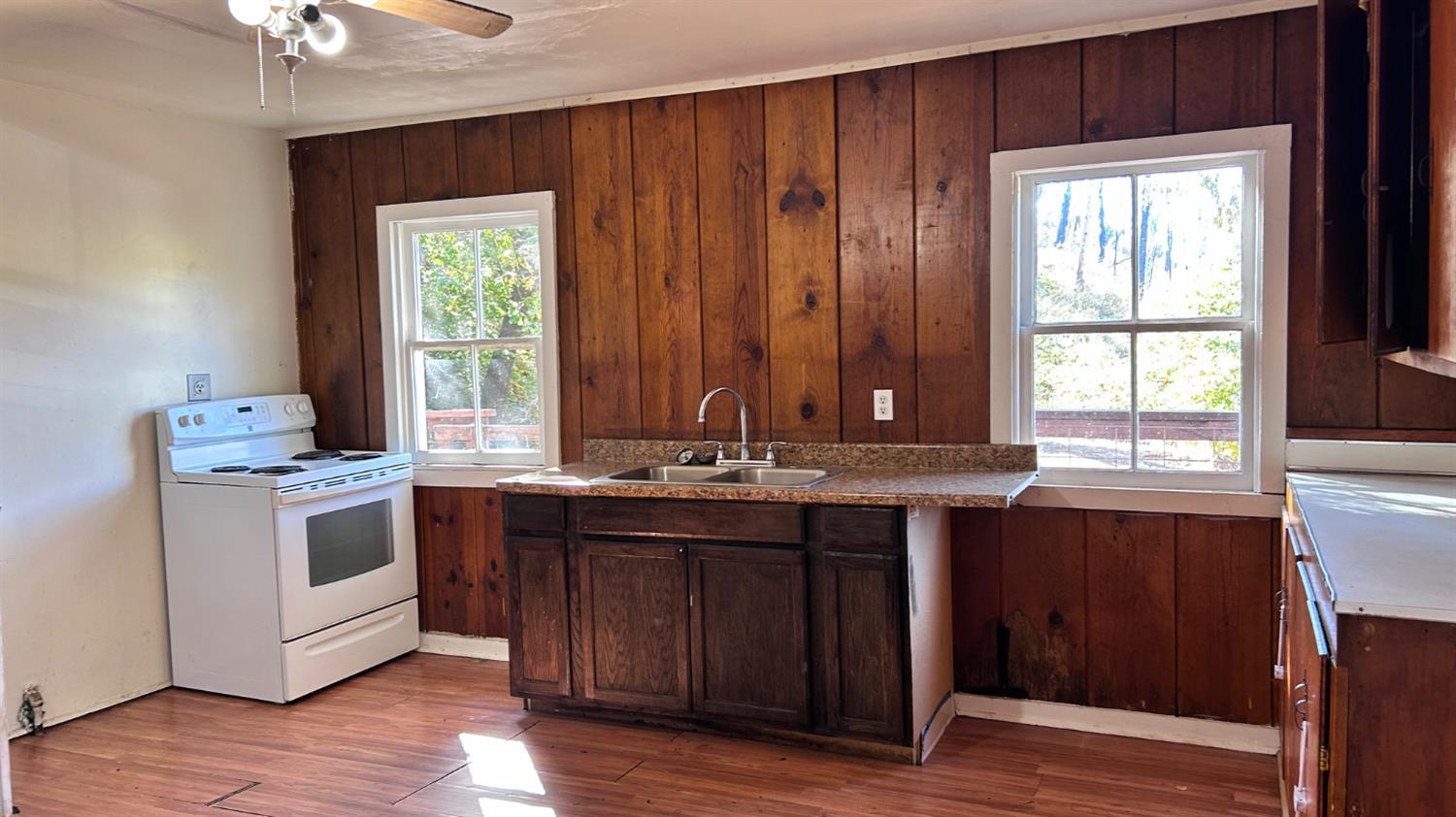 10210 East Murray Creek Road Mountain Ranch, CA 95246 - Photo 10 of 16 a kitchen with a sink and wooden cabinets