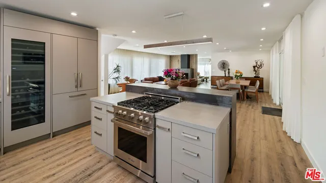 a kitchen with a stove and a refrigerator
