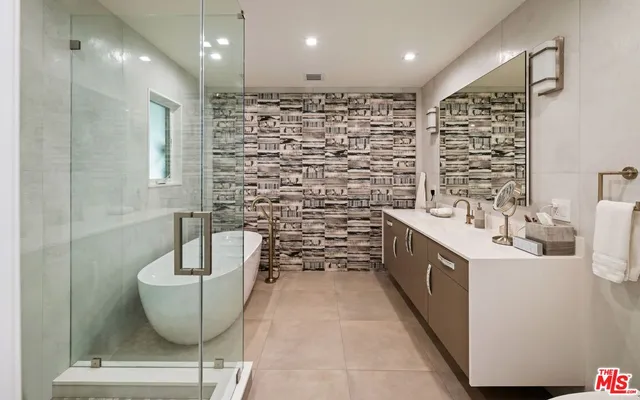 a bathroom with a bathtub and a sink