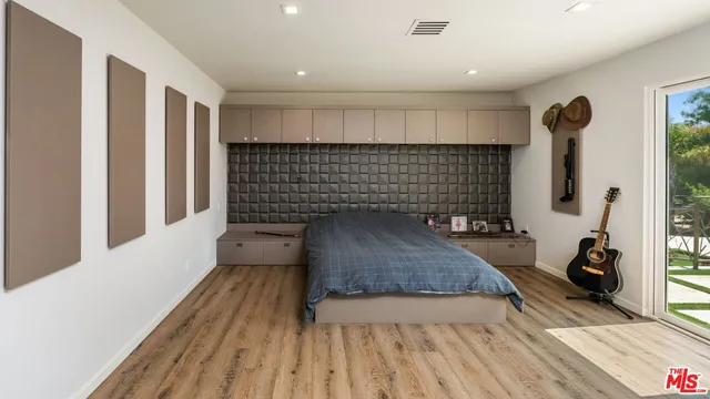 a living room with a couch and a rug