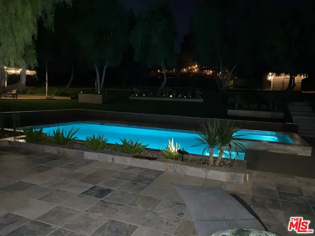 a room with pool table table and chairs