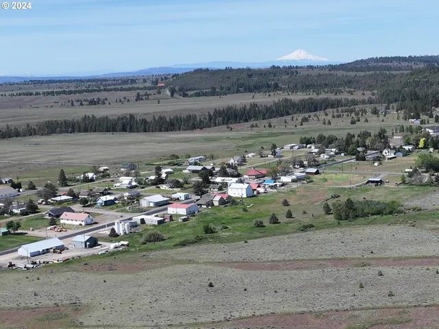 an aerial view of a town with couple of houses