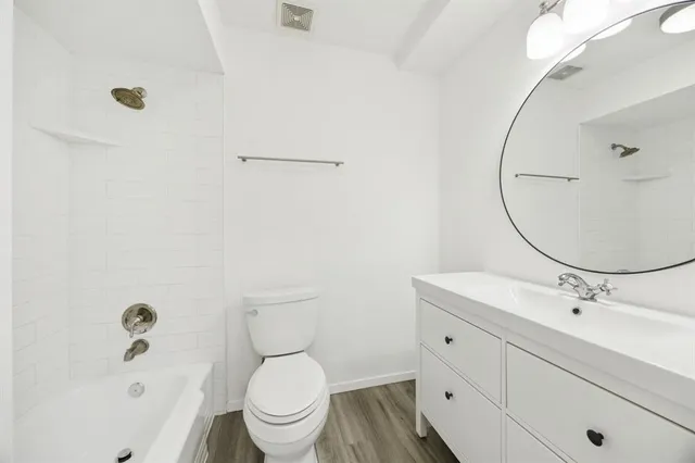 a view of room with wooden floor