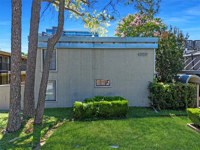 a view of a backyard with sitting area