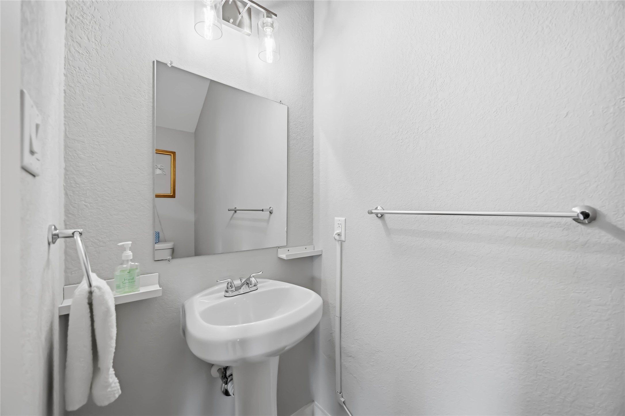 5403 Amy Street Houston, TX 77028 - Photo 12 of 28 a bathroom with a sink a mirror and a shower