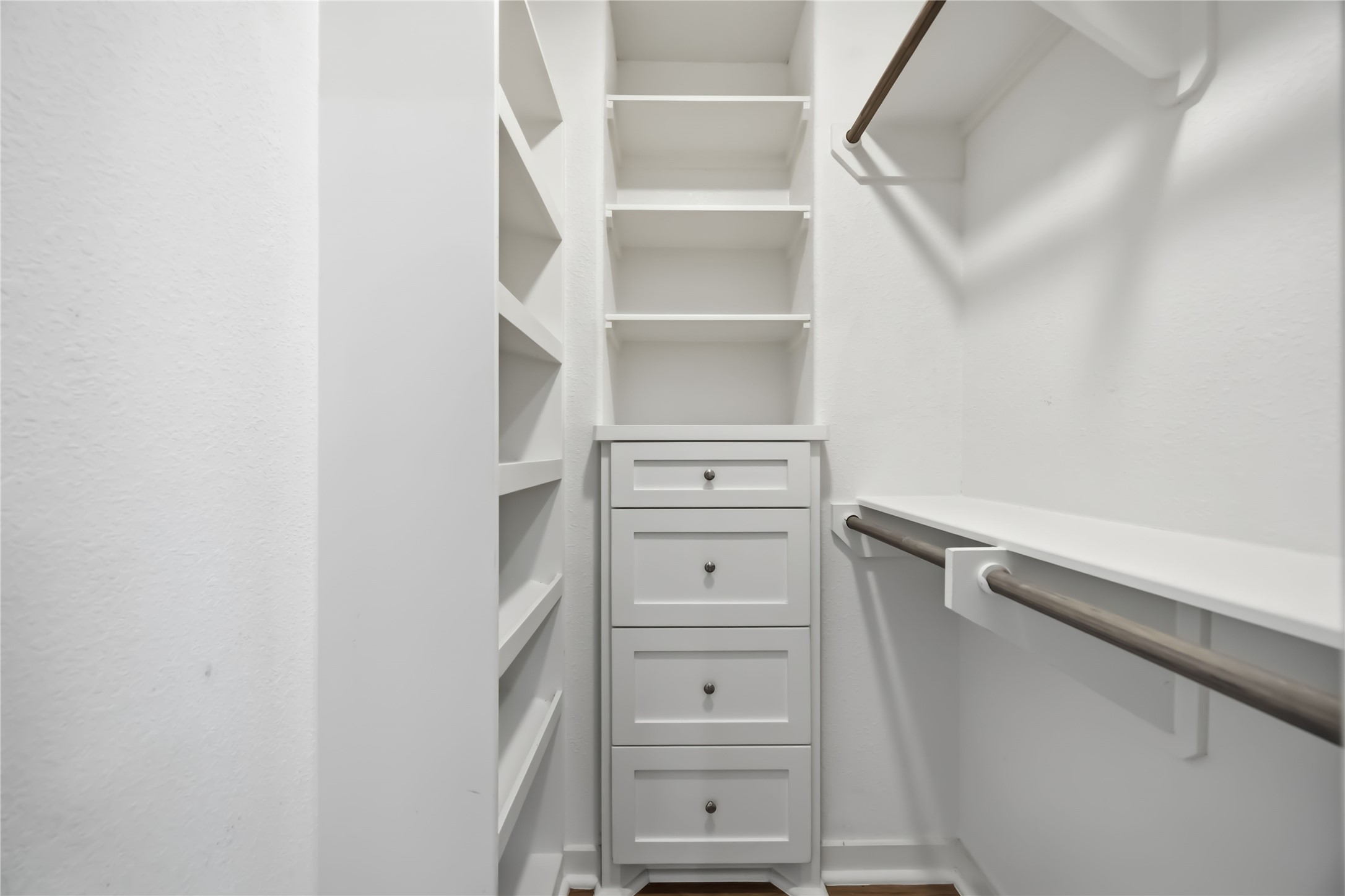 5403 Amy Street Houston, TX 77028 - Photo 21 of 28 a view of walk in closet with empty racks