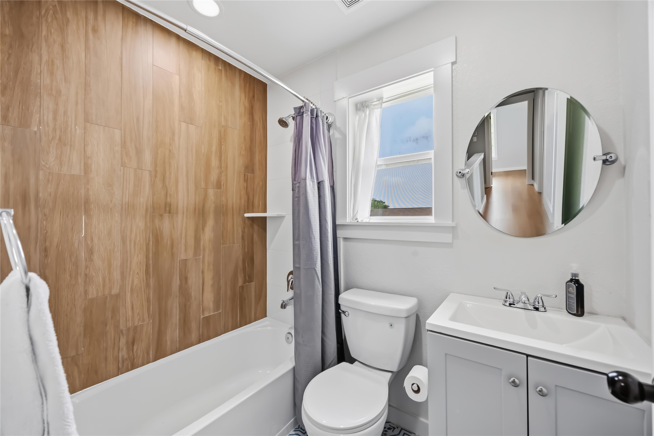 5403 Amy Street Houston, TX 77028 - Photo 23 of 28 a white toilet sitting next to a bathroom sink and tub
