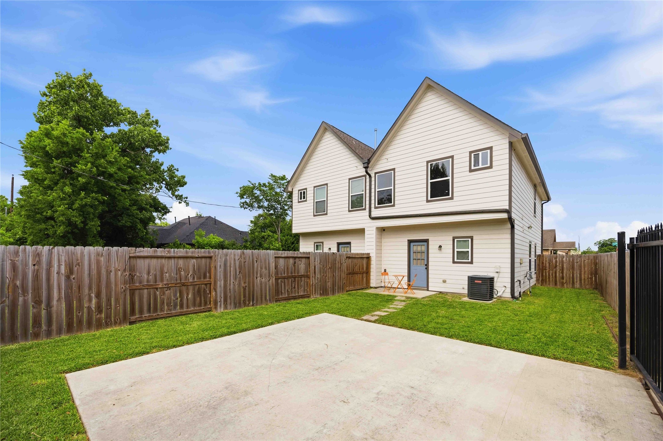 5403 Amy Street Houston, TX 77028 - Photo 26 of 28 a view of a white house in front of a yard with wooden fence
